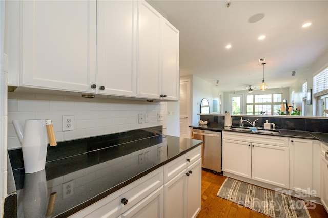 kitchen with ceiling fan, dishwasher, sink, white cabinets, and dark hardwood / wood-style flooring