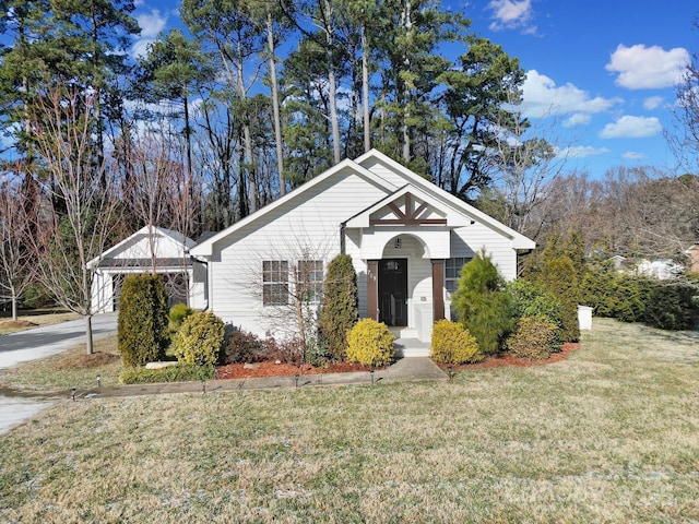 bungalow with a garage and a front yard