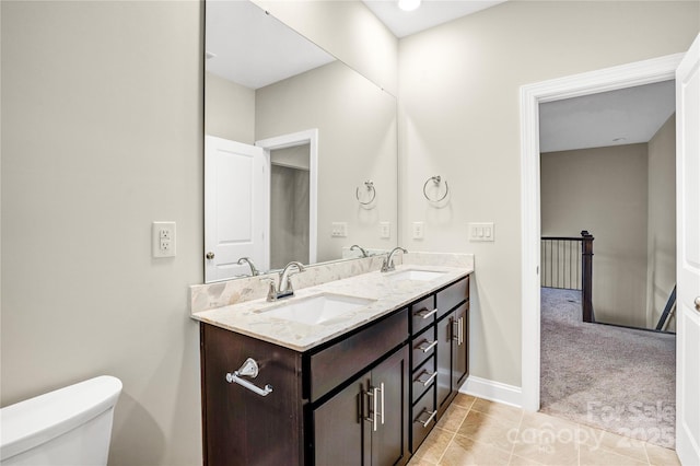 bathroom with toilet and vanity