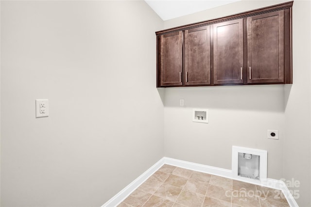 laundry area with hookup for an electric dryer, cabinets, and washer hookup