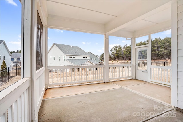 unfurnished sunroom with a wealth of natural light