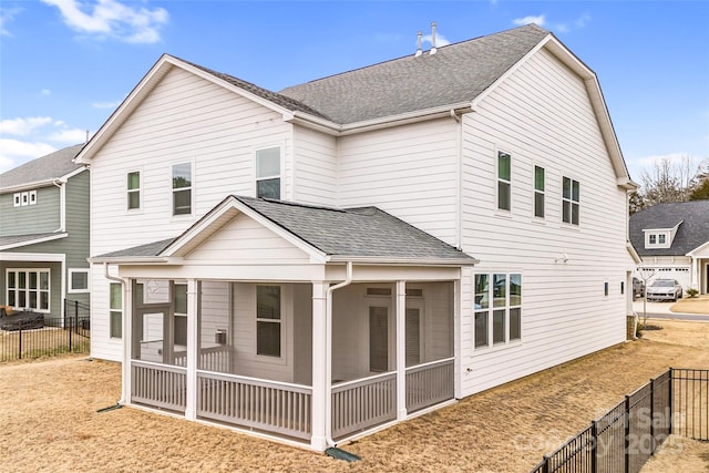 back of house with a sunroom