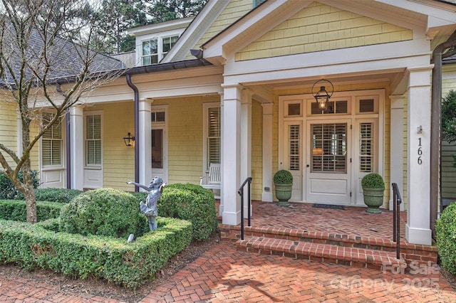 property entrance featuring a porch