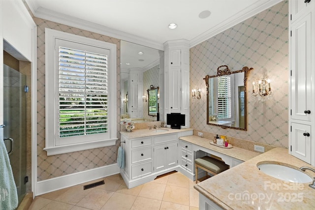 bathroom with vanity, crown molding, and tile patterned flooring