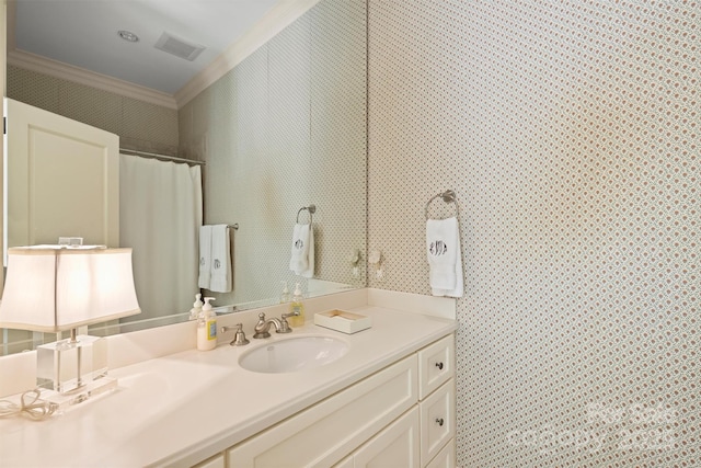 bathroom with vanity and ornamental molding