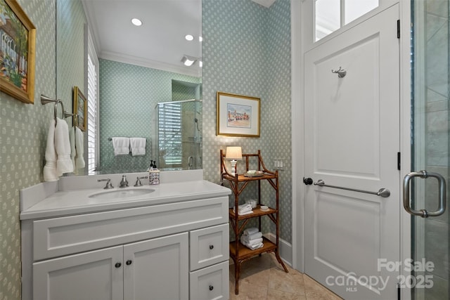 bathroom featuring vanity, ornamental molding, tile patterned flooring, and a shower with door