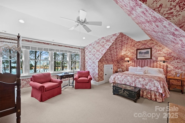 carpeted bedroom with ceiling fan and lofted ceiling