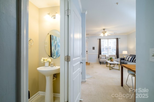 bathroom featuring crown molding and ceiling fan