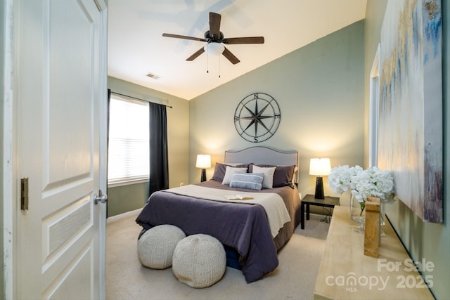 carpeted bedroom featuring ceiling fan and lofted ceiling