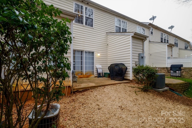 back of house featuring central air condition unit and a patio