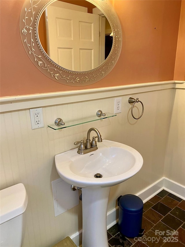 bathroom featuring toilet