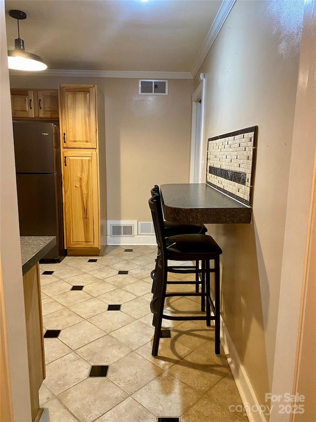 dining area with crown molding