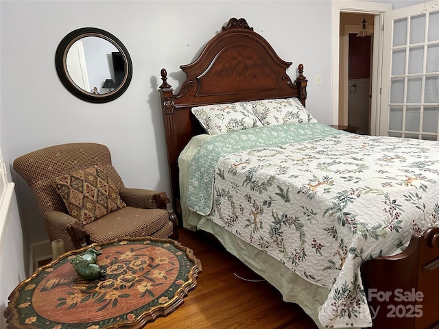 bedroom featuring dark wood-type flooring