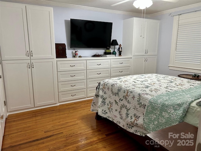 bedroom with crown molding, wood-type flooring, and ceiling fan