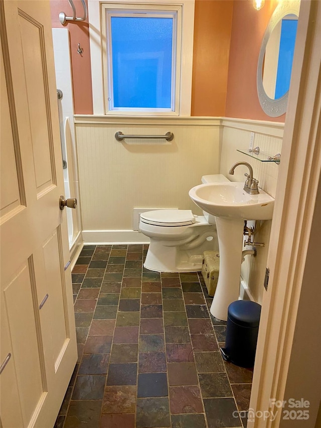 bathroom featuring sink and toilet