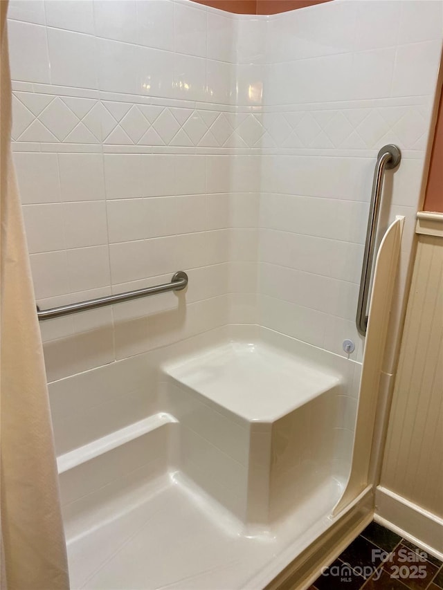 bathroom with a tile shower