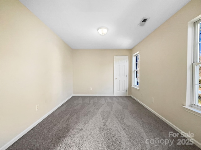 unfurnished room featuring carpet floors