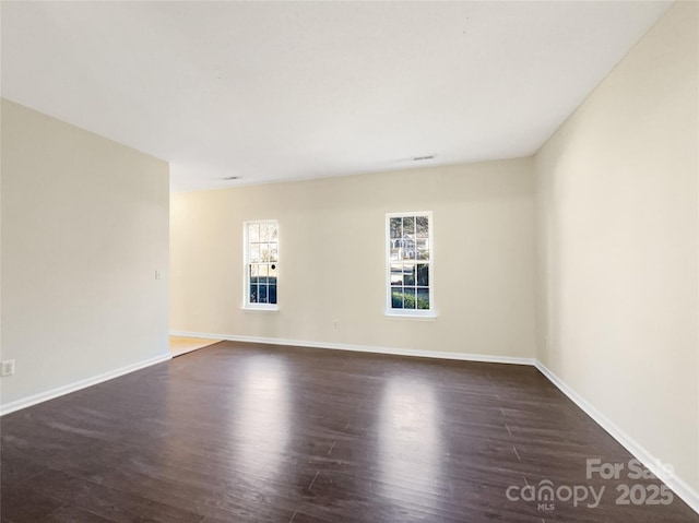 empty room featuring dark hardwood / wood-style floors