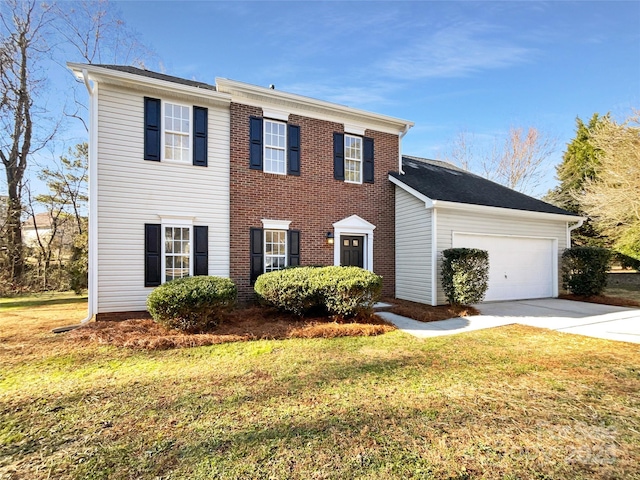 colonial-style house featuring a garage and a front lawn