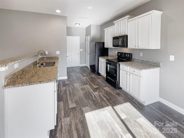 kitchen with black appliances, white cabinetry, sink, dark hardwood / wood-style floors, and light stone counters