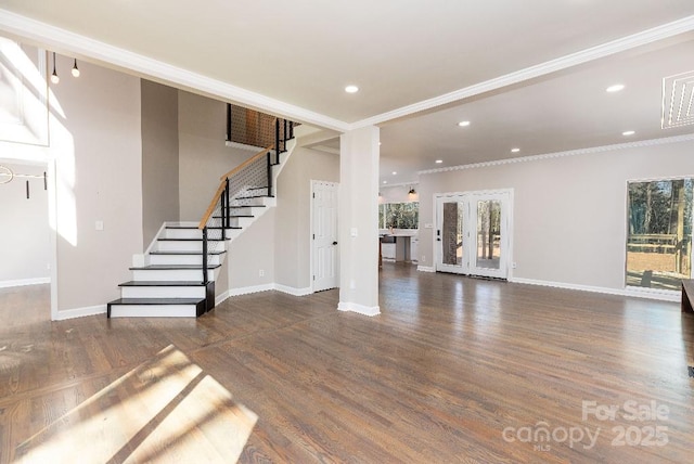 unfurnished living room featuring french doors, crown molding, and dark hardwood / wood-style floors