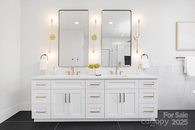 bathroom featuring vanity, a shower, and tile patterned floors