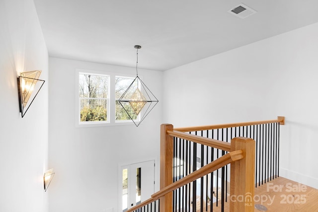 corridor with hardwood / wood-style floors