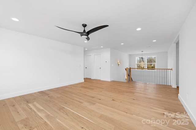 unfurnished living room with ceiling fan and light hardwood / wood-style floors