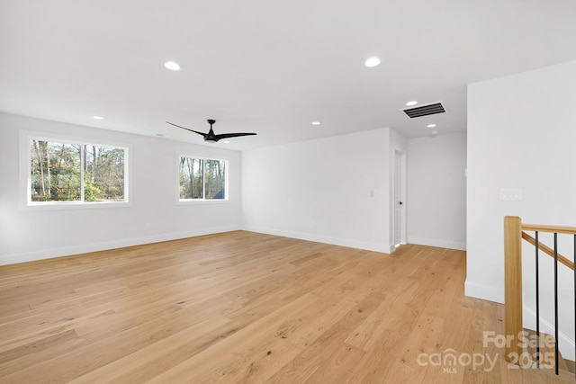 empty room featuring ceiling fan and light hardwood / wood-style floors