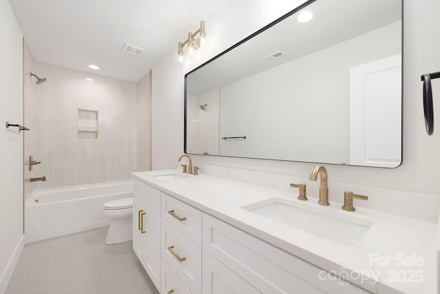 full bathroom featuring tiled shower / bath combo, vanity, tile patterned flooring, and toilet