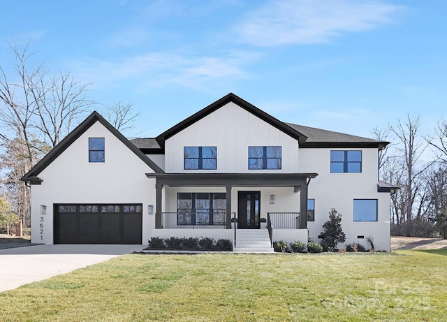 modern farmhouse featuring a front yard and covered porch