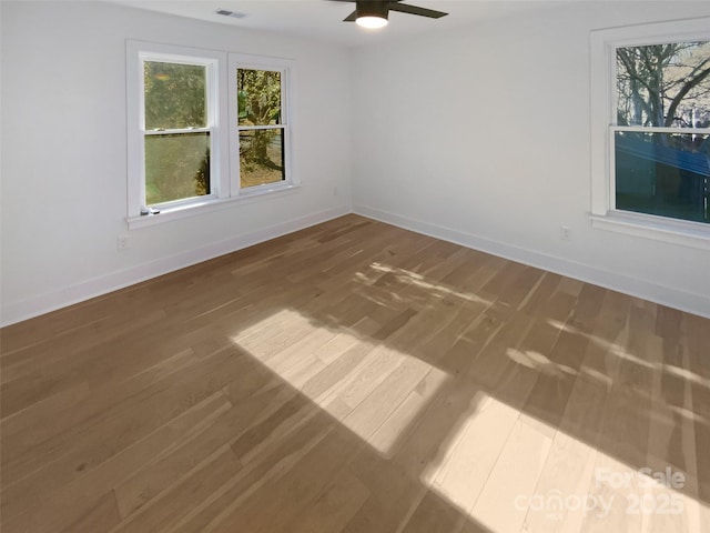 spare room featuring ceiling fan and hardwood / wood-style flooring