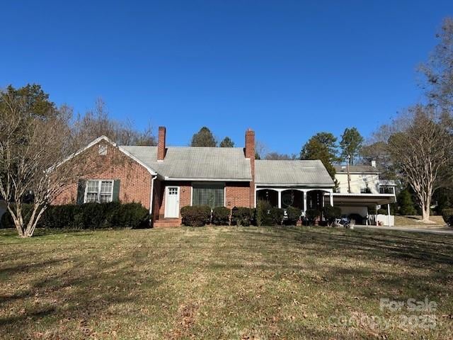 single story home with a carport and a front yard