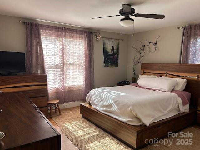 bedroom featuring ceiling fan and light hardwood / wood-style floors