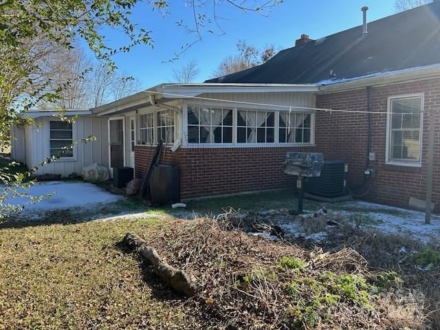 view of property exterior with a patio area