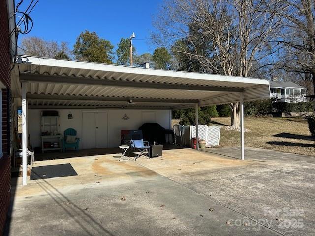 view of parking with a carport