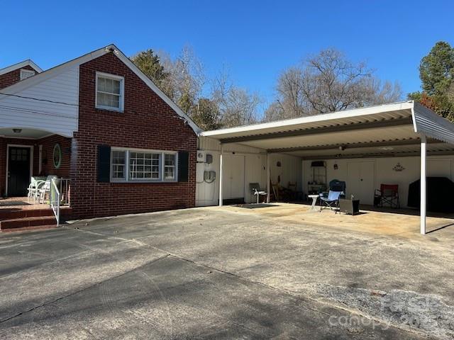 exterior space featuring a carport