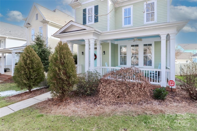 view of front of house with ceiling fan and a porch