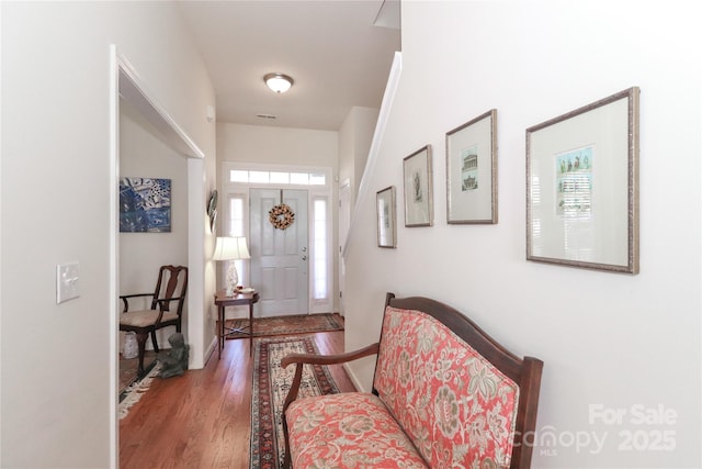 foyer entrance with hardwood / wood-style floors