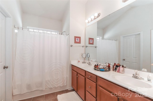 bathroom featuring vanity, tile patterned flooring, and shower / bath combination with curtain