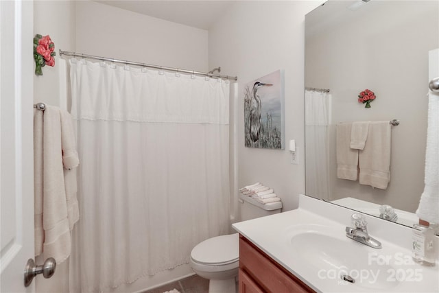 bathroom with toilet, vanity, and a shower with shower curtain