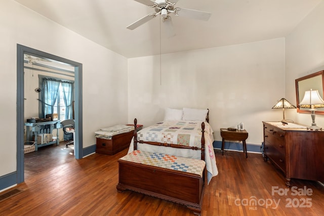 bedroom featuring dark wood-type flooring and ceiling fan