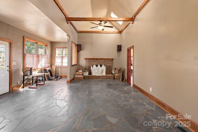 unfurnished living room featuring a brick fireplace, high vaulted ceiling, beam ceiling, and ceiling fan