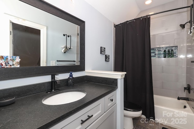 full bathroom with shower / bath combo with shower curtain, toilet, and vanity