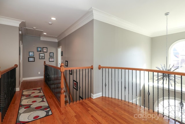 hallway with crown molding and wood-type flooring