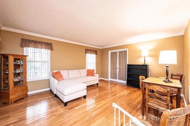 living room with crown molding and hardwood / wood-style floors