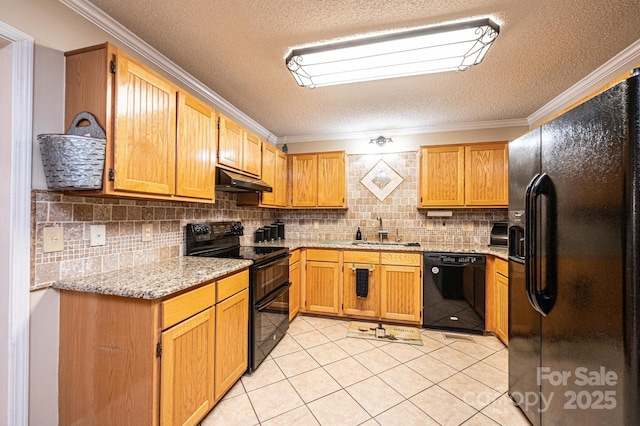 kitchen with a textured ceiling, black appliances, decorative backsplash, sink, and light tile patterned flooring