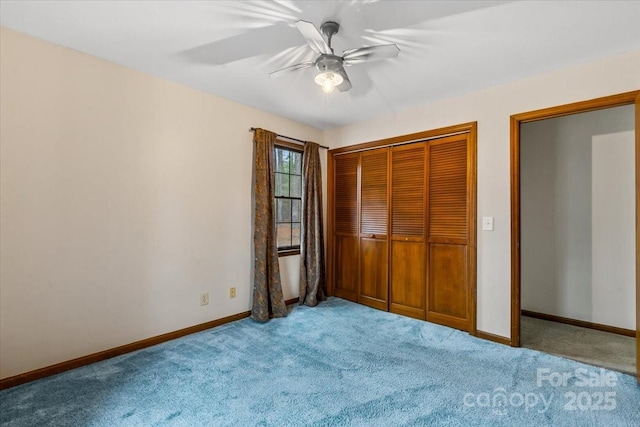 unfurnished bedroom featuring ceiling fan, carpet flooring, and a closet