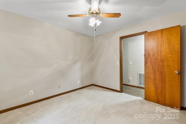 empty room with light carpet and ceiling fan