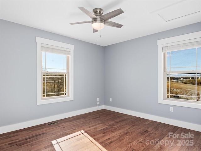 empty room featuring ceiling fan and hardwood / wood-style flooring